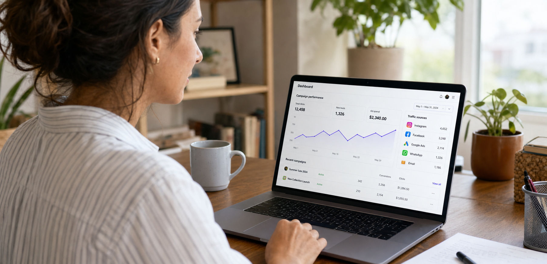Small-business owner reviewing campaign analytics on a laptop